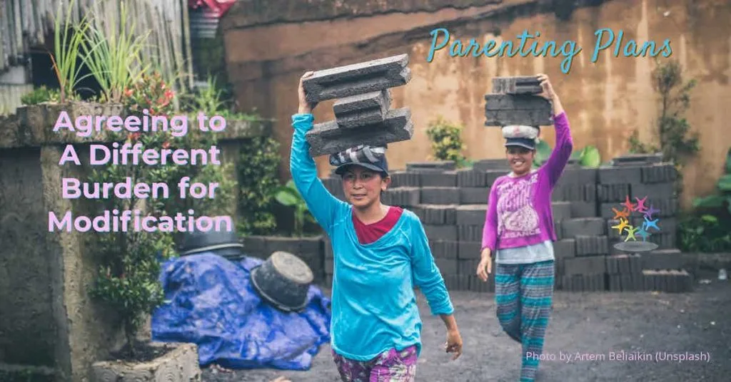 Florida Parenting Plans: Agreeing to a Different Burden for Modification. Two women walking while carrying heavy burden concrete bricks. Photo by Artem Beliaikin (Unsplash).