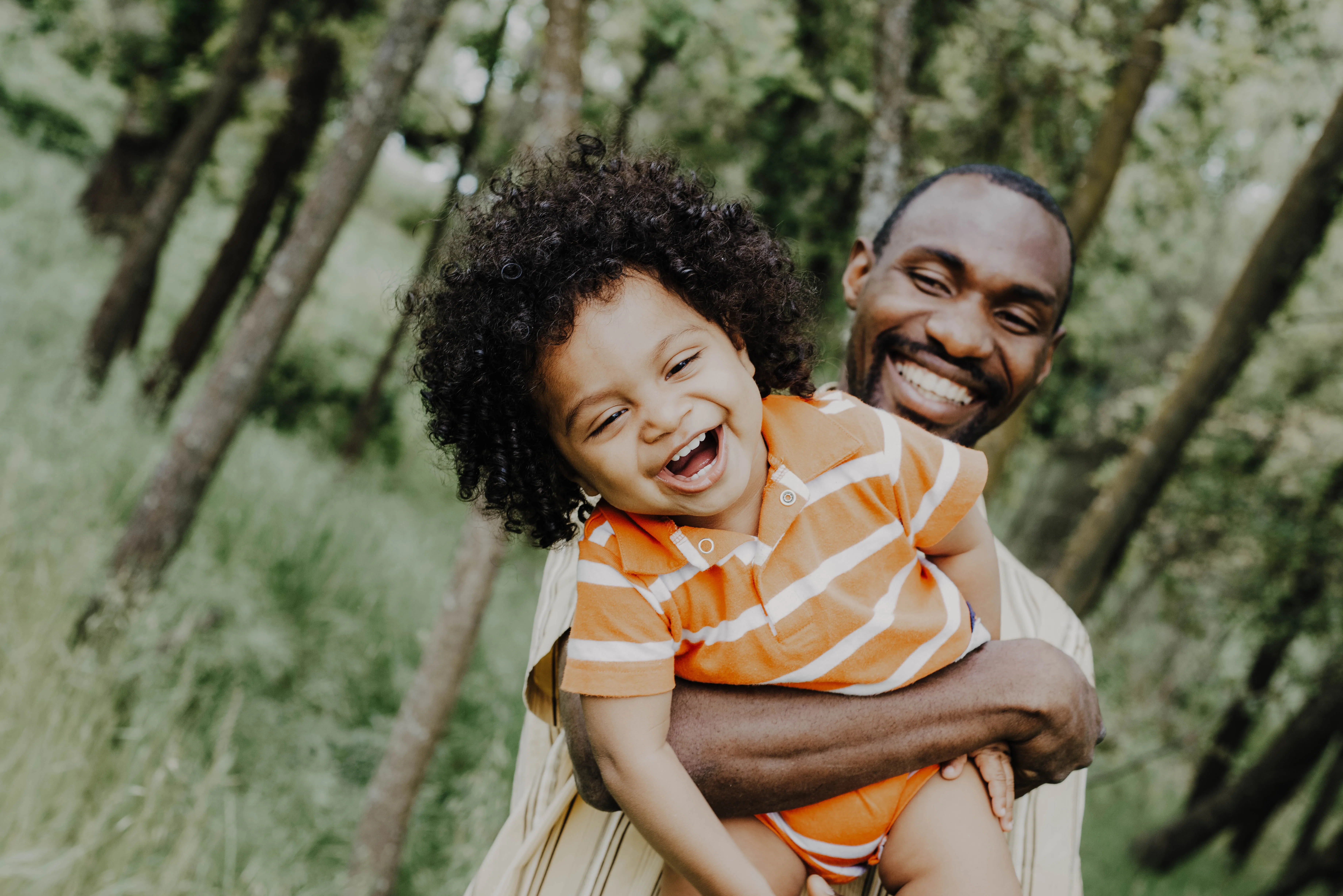 A Parent’s Regular Involvement with the Child Is Exercise of Custody Rights. Man with child in orange striped shirt. Joice Kelly (Unsplash)